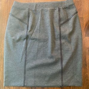 Grey stretch knit skirt. Accents with black.